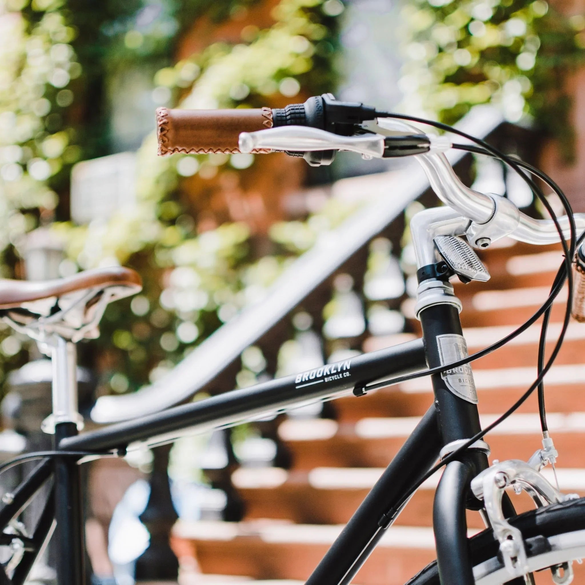 Black diamond frame bicycle in front of stairs